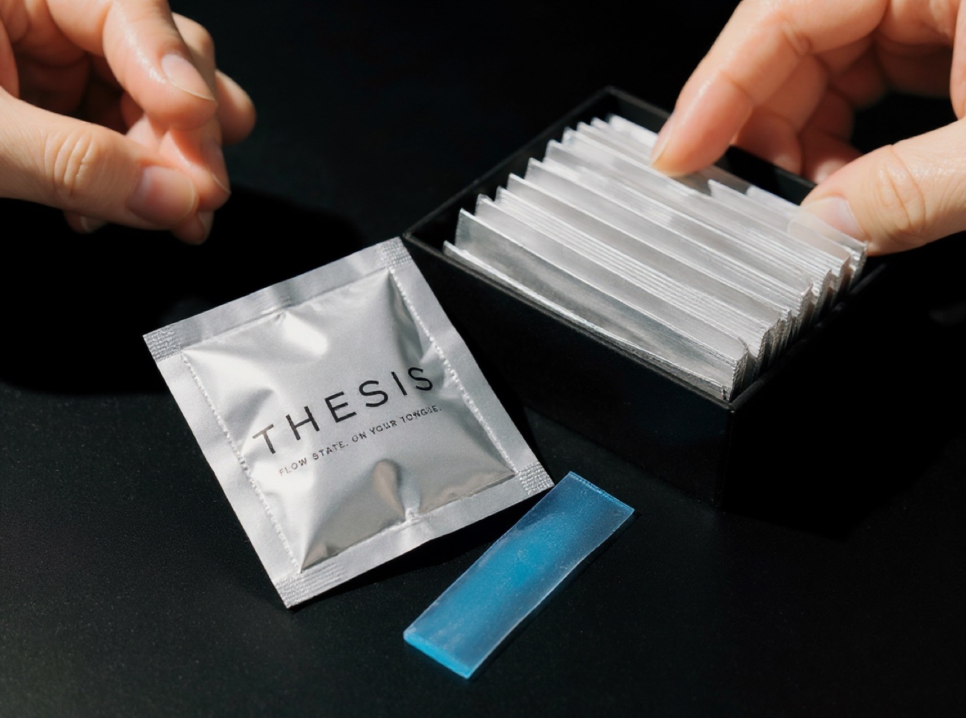 THESIS box opened with a blue dissolvable strip