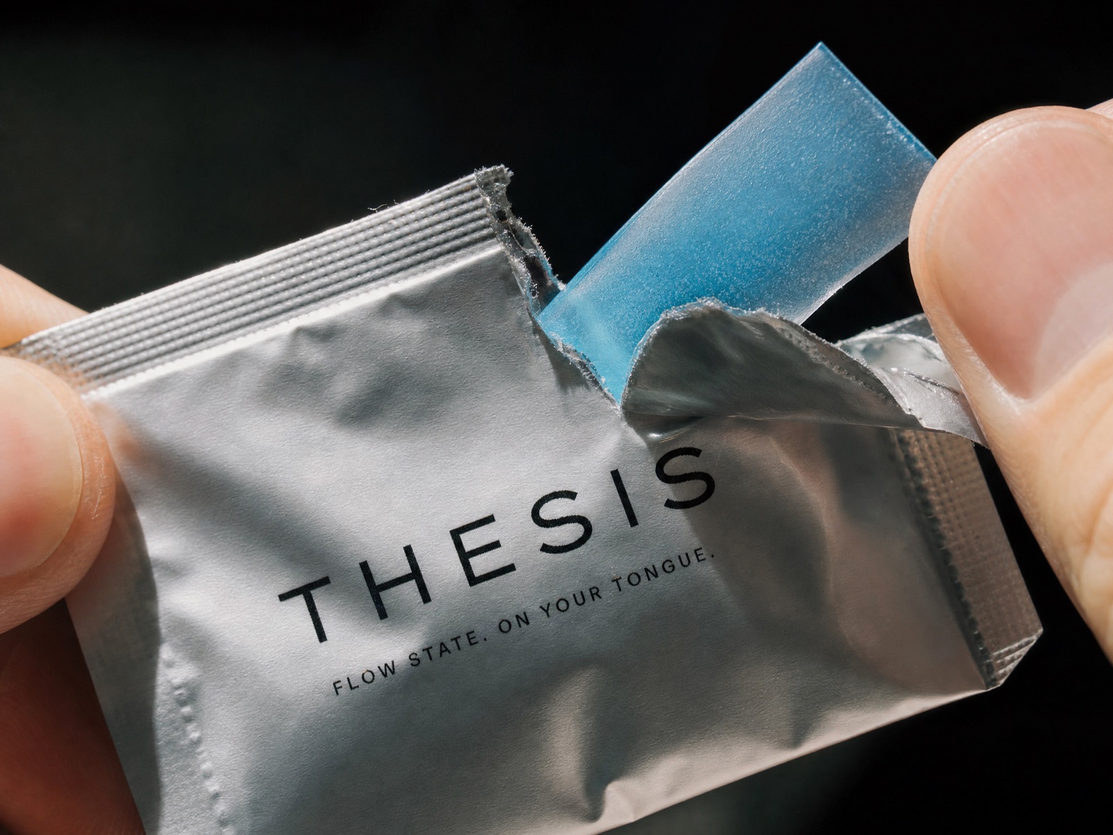 THESIS single-serve foil sachet with a blue dissolvable strip